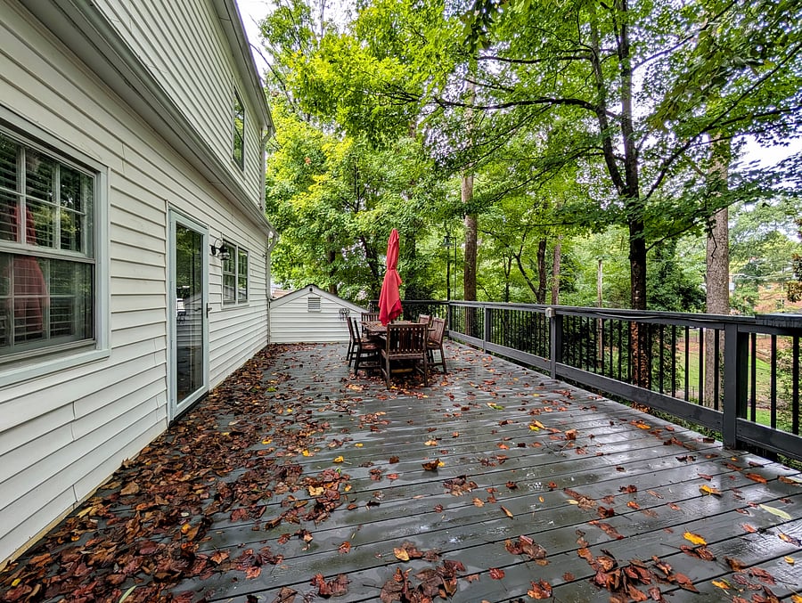 Spacious back deck conveniently located right outside of kitchen. Table seating for 6!