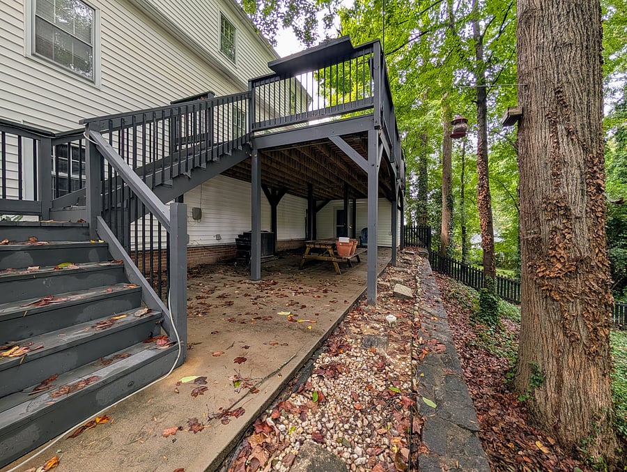 Covered patio space with picnic table.