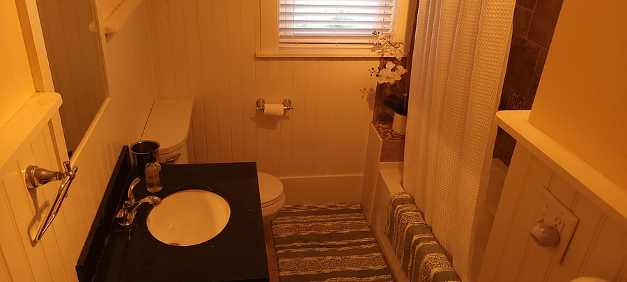 Warm bathroom with extra deep tub.