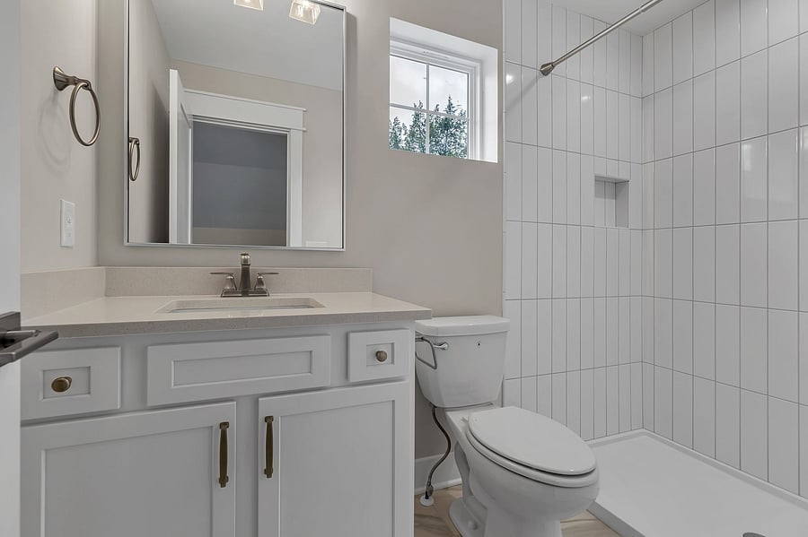 Tenants' private bath to include full starter amenities, bath products, and cleaning supplies. Custom design by an in-house design team, featuring simple spaces, luxury linens, and space-management details unique to the room-rental market.