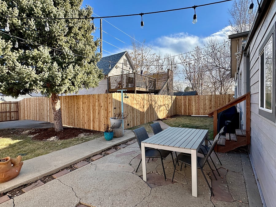 Shared backyard picnic table and clothes line.