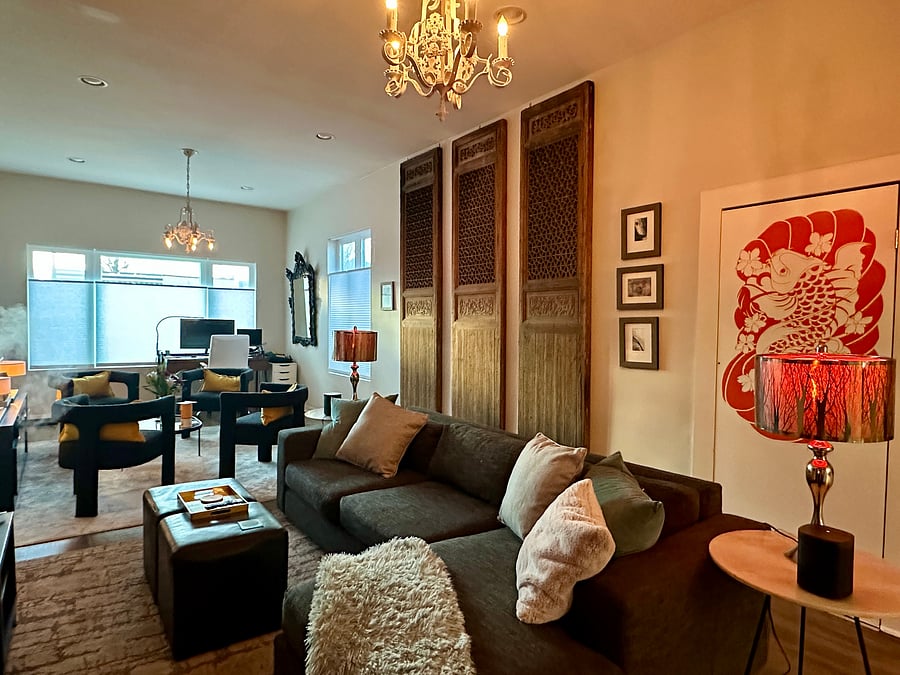 Living room with desk at front windows