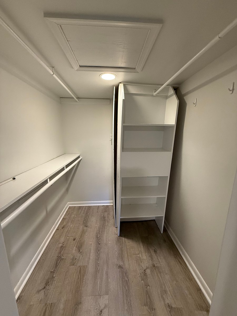 Large closet off the bedroom. Iron and ironing board included.