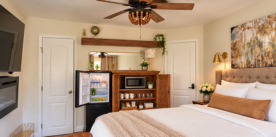 The custom designed hospitality station mixed mixes antique luxury with modern renovations to include a microwave, a Keurig, electric kettle and a raised apartment-sized refrigerator for all your personal items!