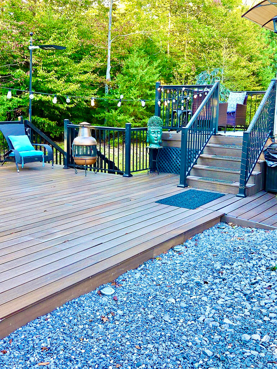 Step onto an expansive deck where warm wood tones, inviting seating, and lush surroundings set the mood for relaxation. The tiered layout creates welcoming spaces to enjoy your morning coffee or unwind after a busy day.