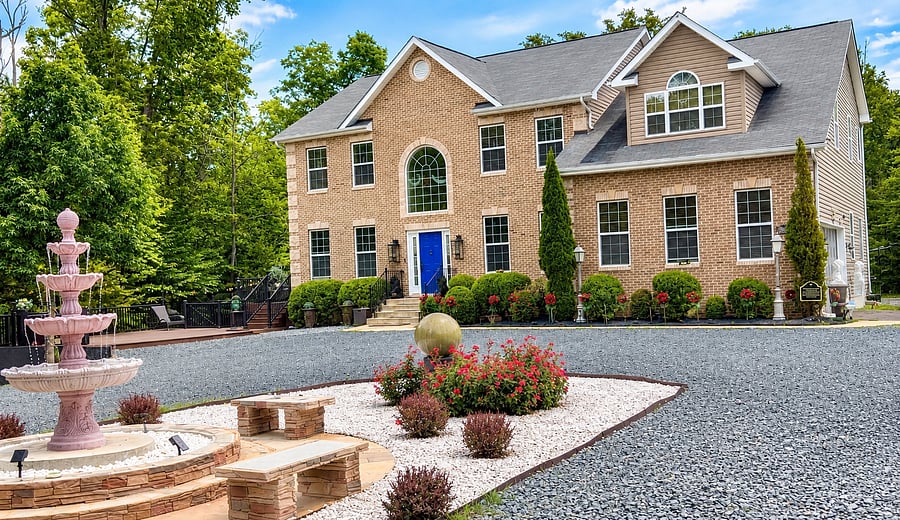 Welcome to Brandywoods Living, where a stately brick exterior, distinctive blue entrance, and landscaped grounds make a striking first impression. The home offers an inviting setting for a comfortable, thoughtfully hosted extended stay.