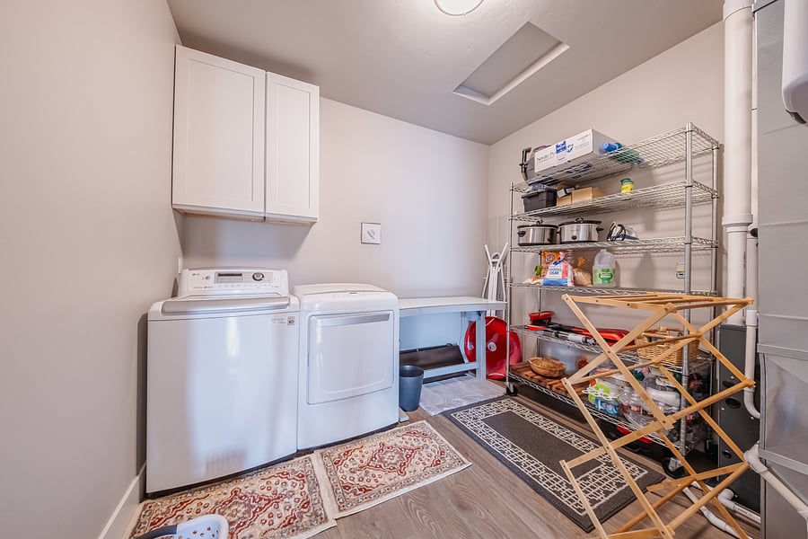 Full sized washer and dryer. An extra adjustable desk, bamboo drying rack and shelves including Crock Pots.