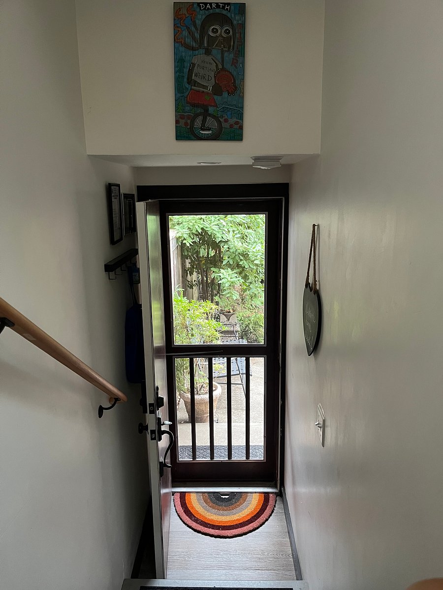Interior view of front entry door and stairs.