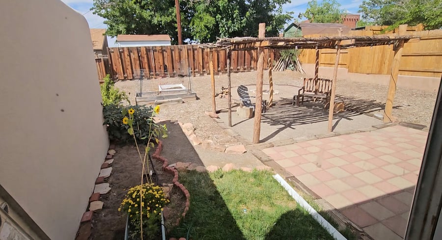Enjoy outdoor living and BarBQ and relaxation in the sun, under the Ramada or in the shade of the porch on the rocker .