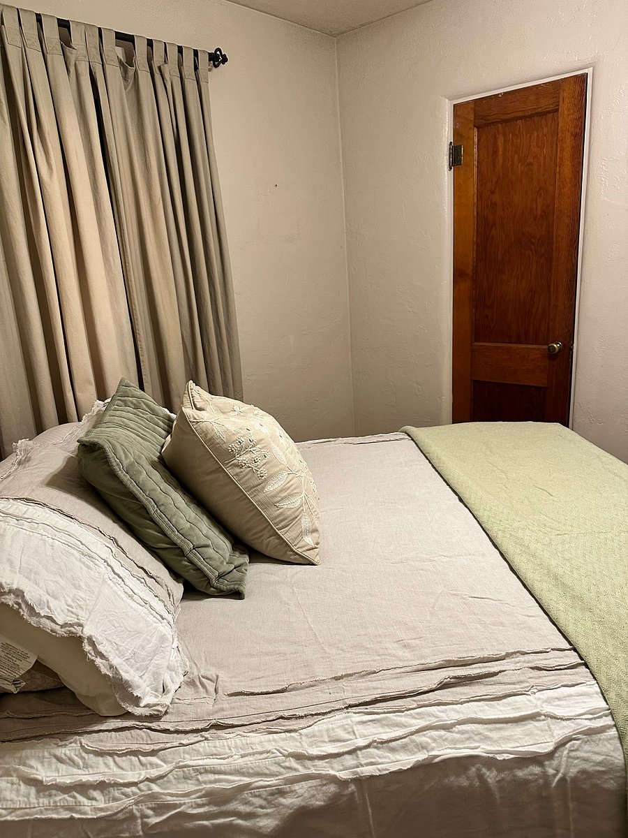Bedroom 2 comfy with hard wood floors, curling fan, a nice big closet, noise machine and black out curtains to help sleep soundly.