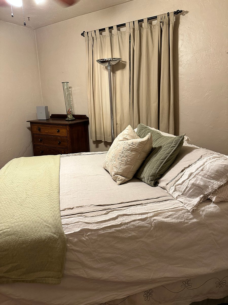 Bedroom 2 comfy with hard wood floors, curling fan, a nice big closet, noise machine and black out curtains to help sleep soundly.