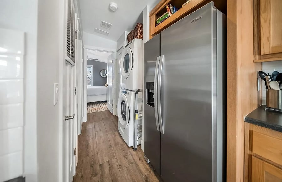 Hallway Unit 1 (main house) with full size side-by-side refrigerator/freezer including ice maker and water dispenser. In-unit washer/dryer.