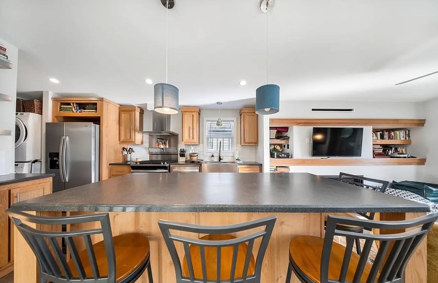 Kitchen in Unit 1 (main house) with eat-in- area on large island.