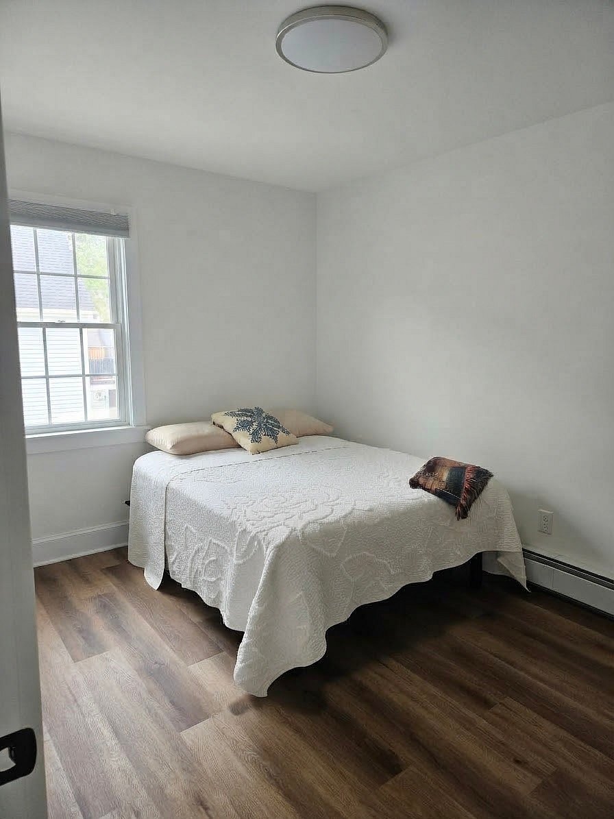 Roomy bedroom, new mattress and pillow with light blocking blinds.