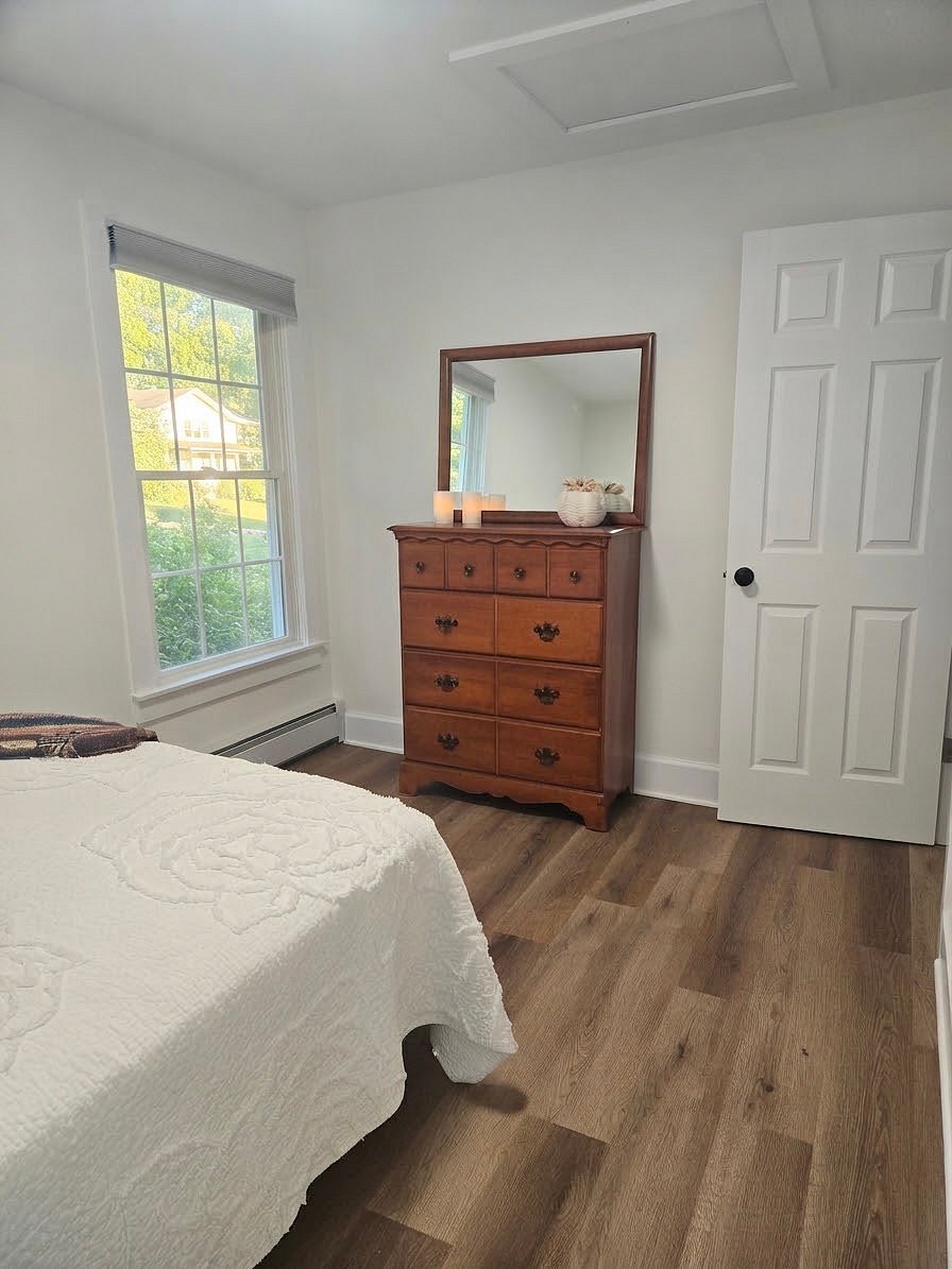 Roomy bedroom, new mattress and pillow with light blocking blinds.