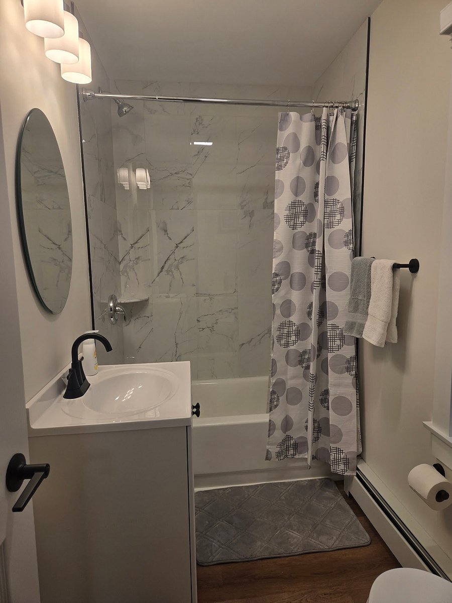 Never used brand new bathroom with full bath and shower.