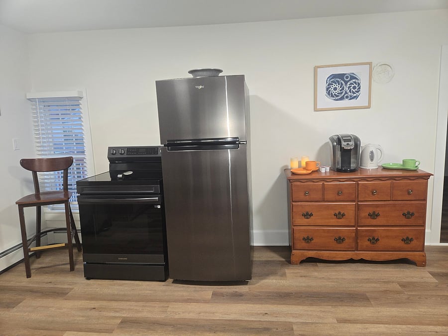 Brand New Fridge/Freezer, oven range, cabinetry and flooring. Very large space with coffee/tea station. Well appointed with plenty of utensils, cooking pans, plates, glassware and mugs.