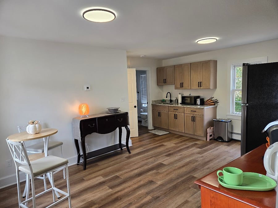 Very Large kitchen with all new cabinets, flooring. Brand new fridge/freezer and 5 burner stove. Bistro eating area, with additional seating available. Plenty of storage in the Tea/Coffee station and side table.