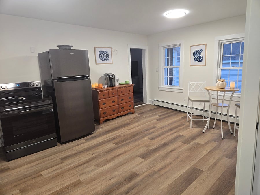 Brand New Fridge/Freezer, oven range, cabinetry and flooring. Very large space with coffee/tea station. Well appointed with plenty of utensils, cooking pans, plates, glassware and mugs.