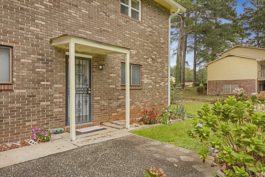 Your own private entrance: a covered entry with a security storm door, steps from your carport parking.