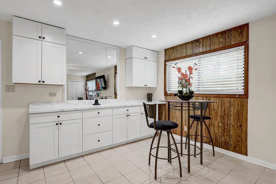 Bright kitchen nook with a bistro table, perfect for morning coffee.