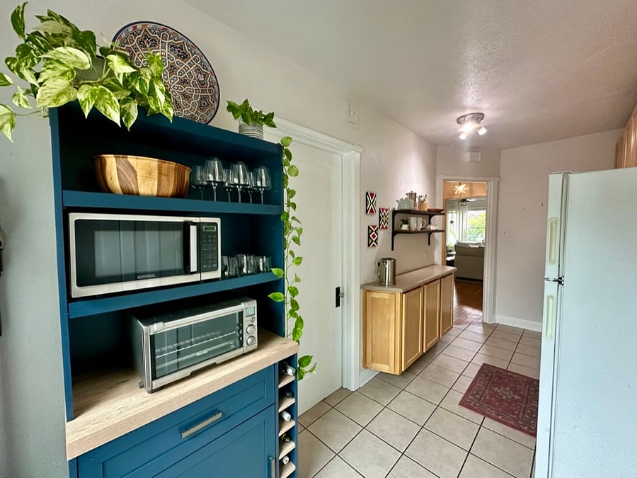 Additional kitchen storage with a microwave, toaster oven, and plenty of space for everyday essentials.