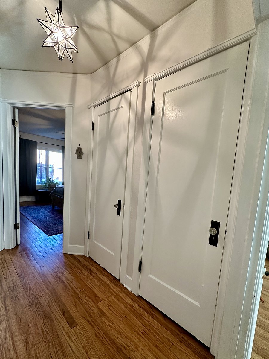 Hallway linen and coat closets add to the abundant storage options throughout the condo.