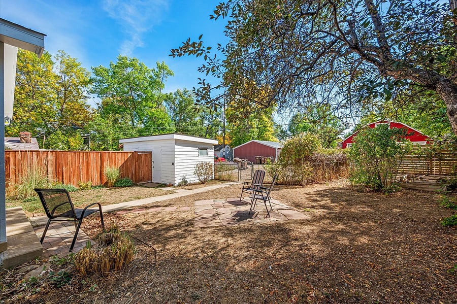 Large, private, quiet, shaded back yard next to a small stream.
