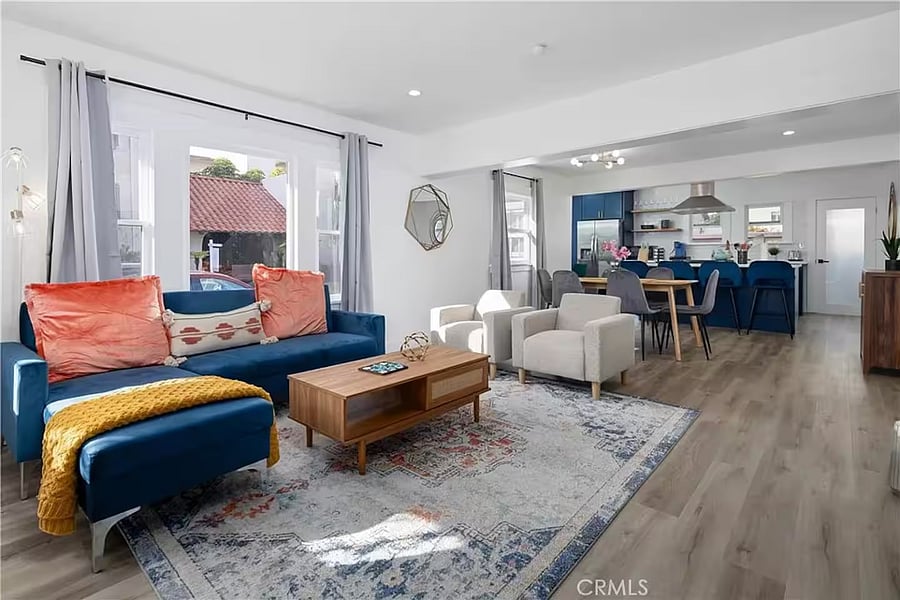 Large living room area with Smart TV, board games, pull out sofa and chairs