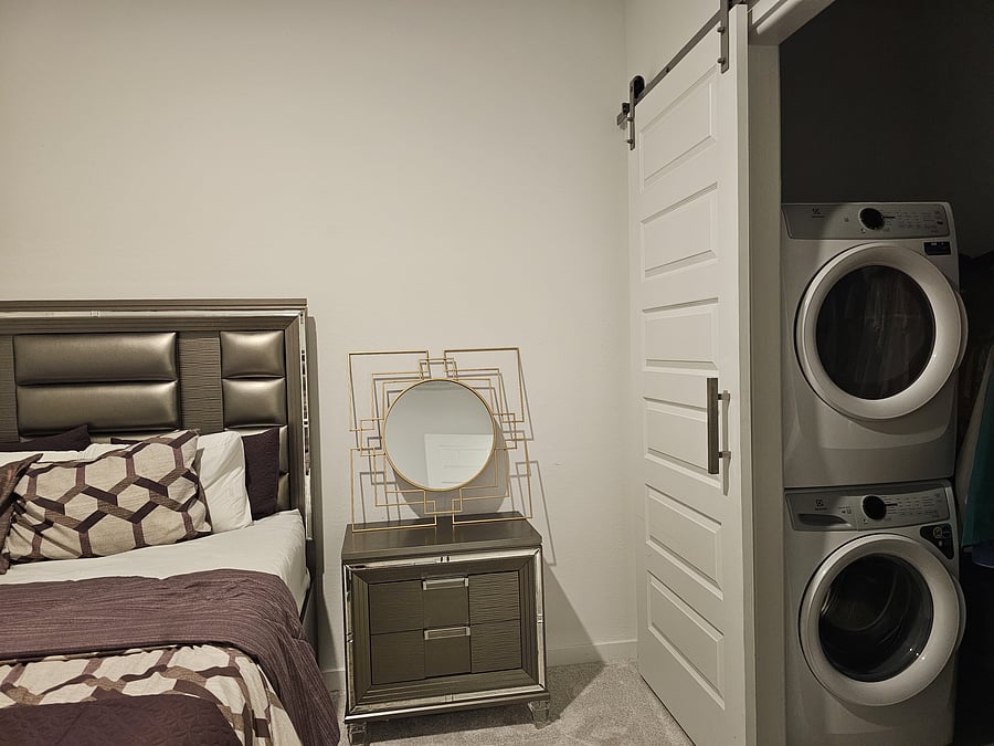 Bedroom with walk-in closet and washer/dryer