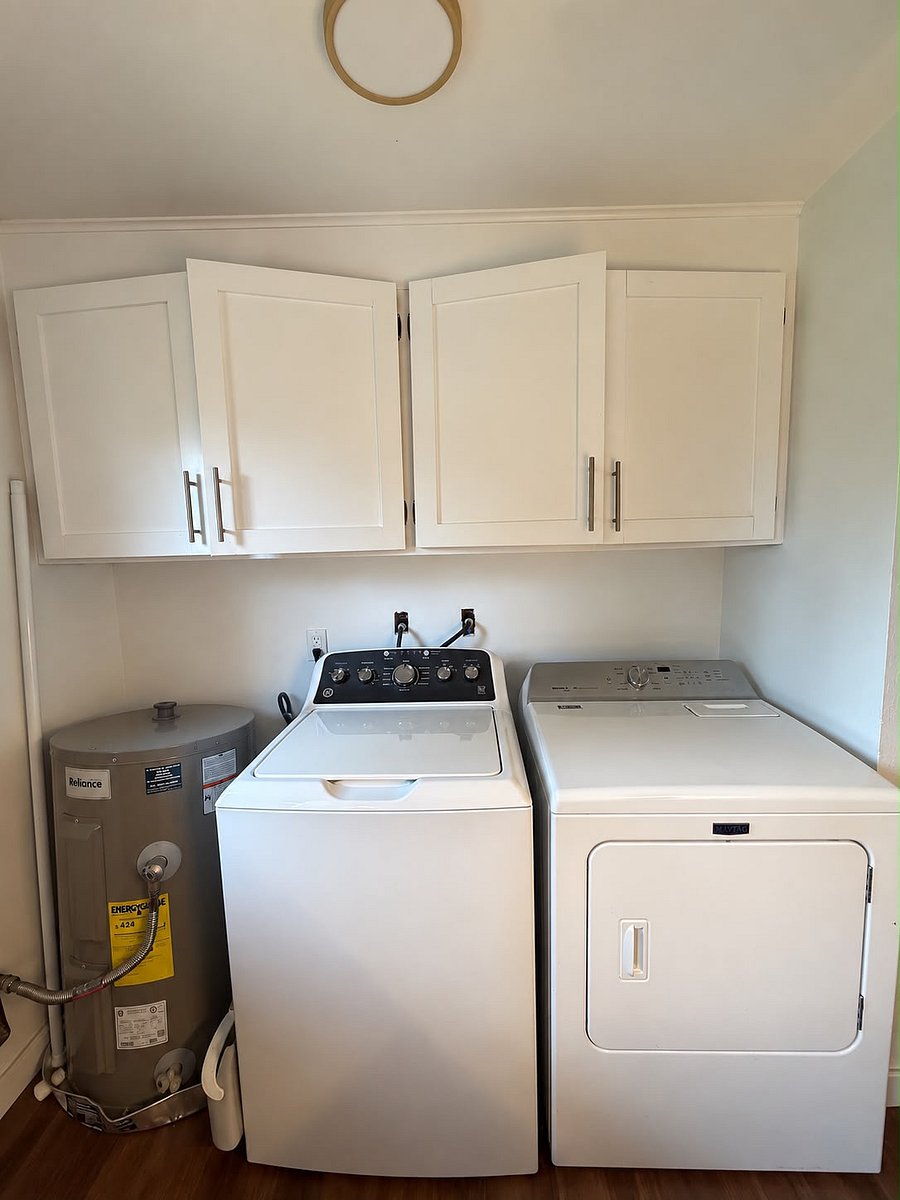 Washer & Dryer on one end of kitchen
