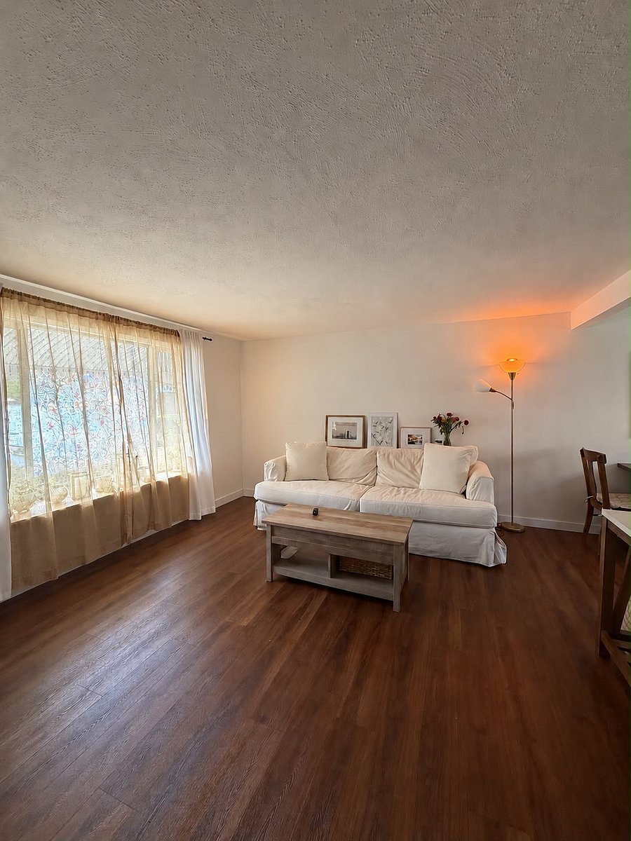 front window, living room, dining nook on the right
