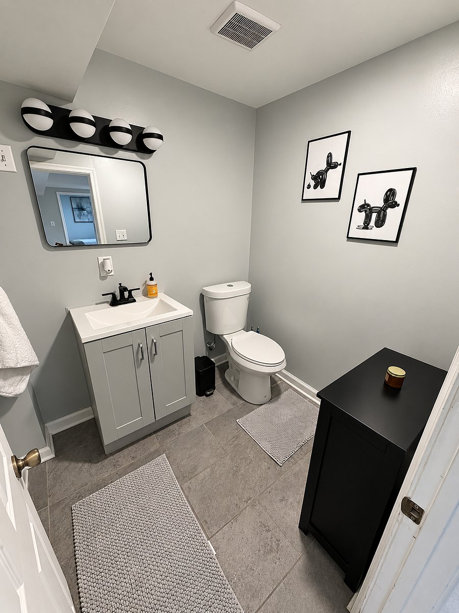Private full bathroom with a spacious glass-enclosed shower and modern finishes.