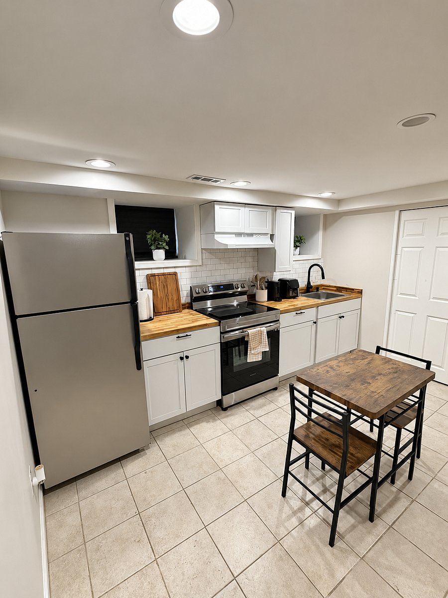 Fully equipped private kitchen with full-size appliances, ample cabinet space, and dining area.