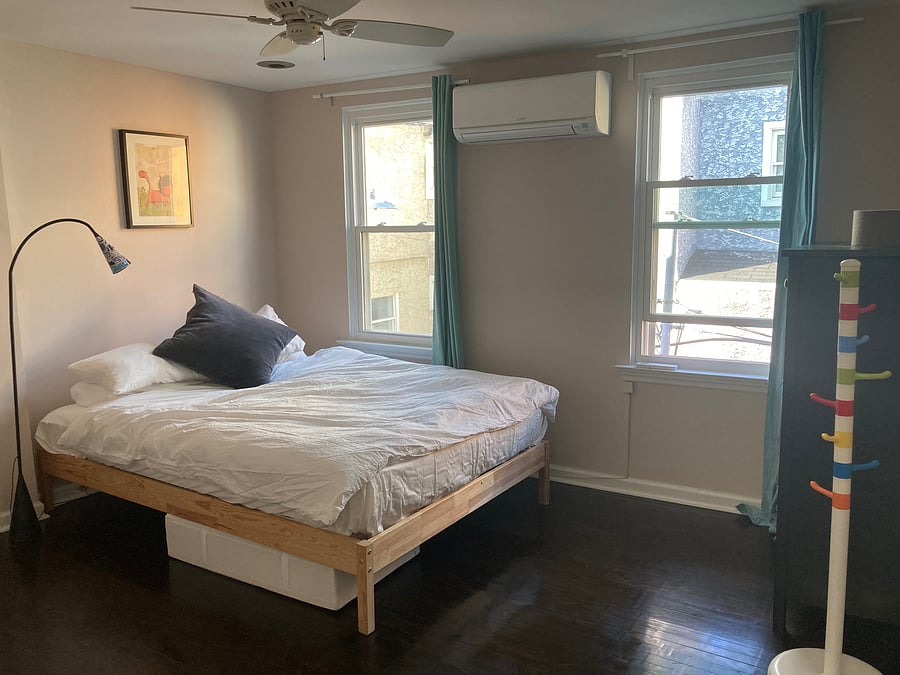 Quiet master bedroom with queen-sized bed, dresser, closet, linen chest and book case