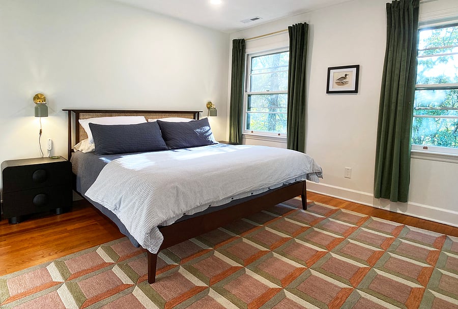 Primary bedroom with king bed, ensuite bath, and walk-in closet.