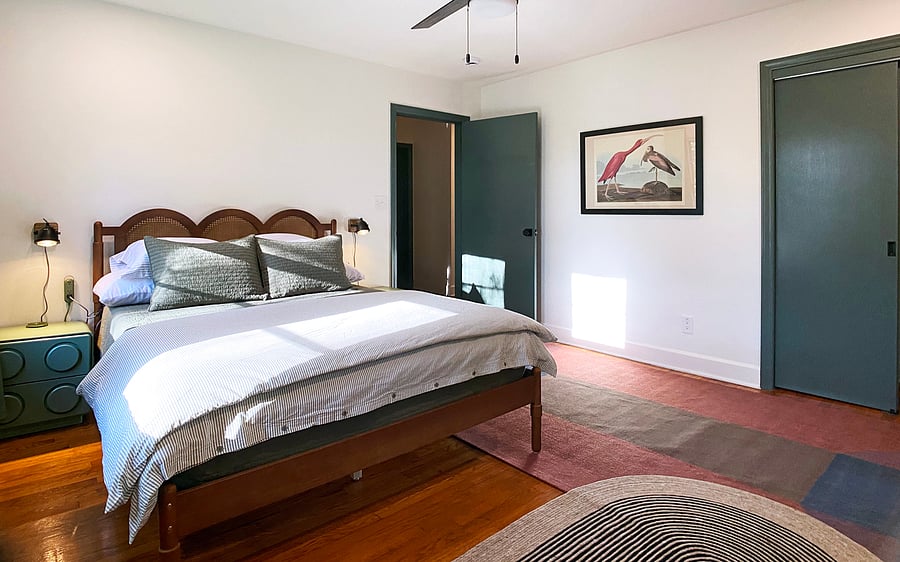 Bedroom 2 with queen bed, closet, and shared bath.