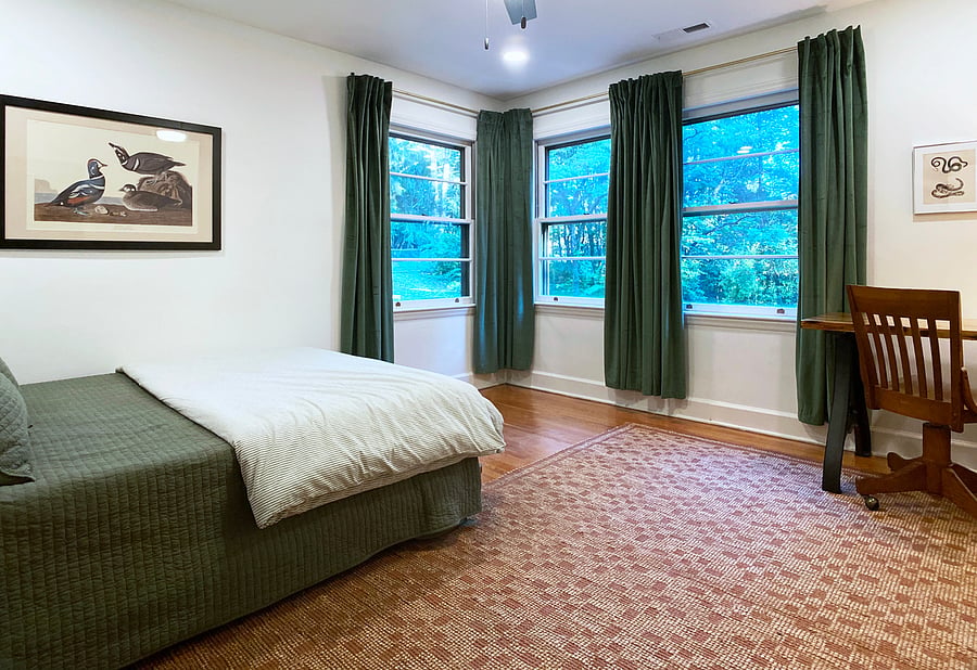 Bedroom 3 with queen bed, closet, shared bath, and desk.