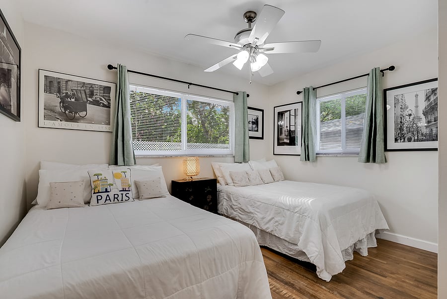 This corner bedroom had 2 double beds, but now it has 1 queen size bed. See next photo!