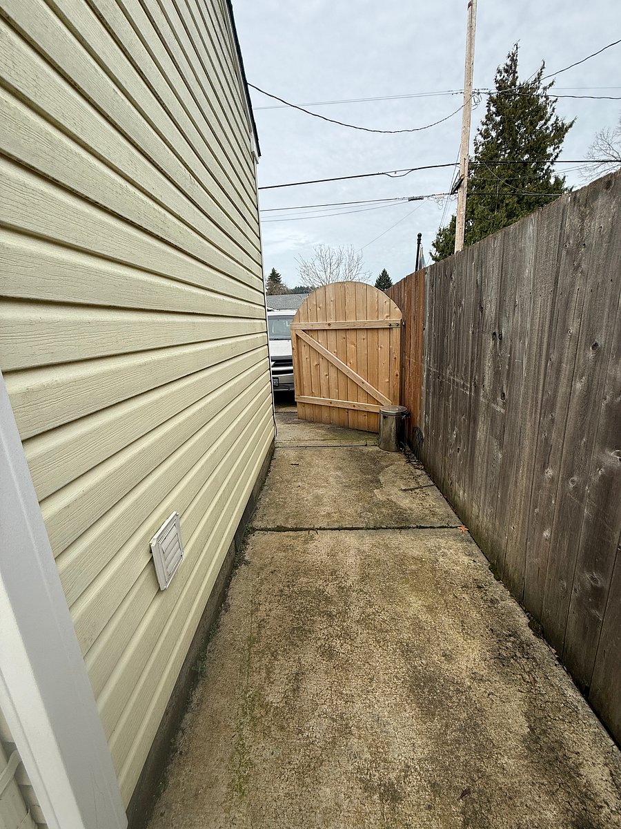 Side of the house - fully fenced.