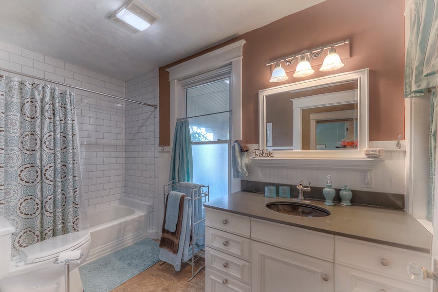 Bathroom with vanity,   tiled shower and tub