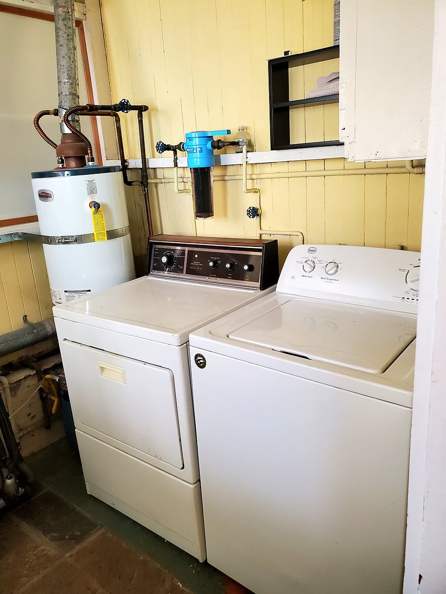 Washer and dryer located in back porch, off the kitchen.