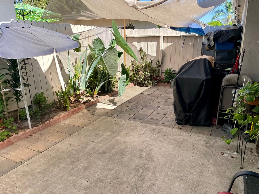 Back patio with BBQ and chairs