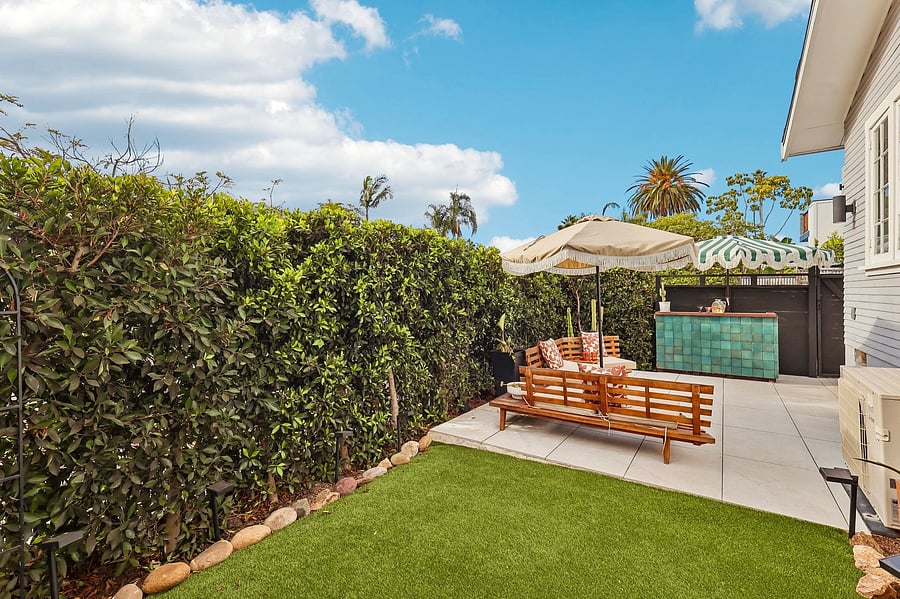 Backyard lounge area and turf.