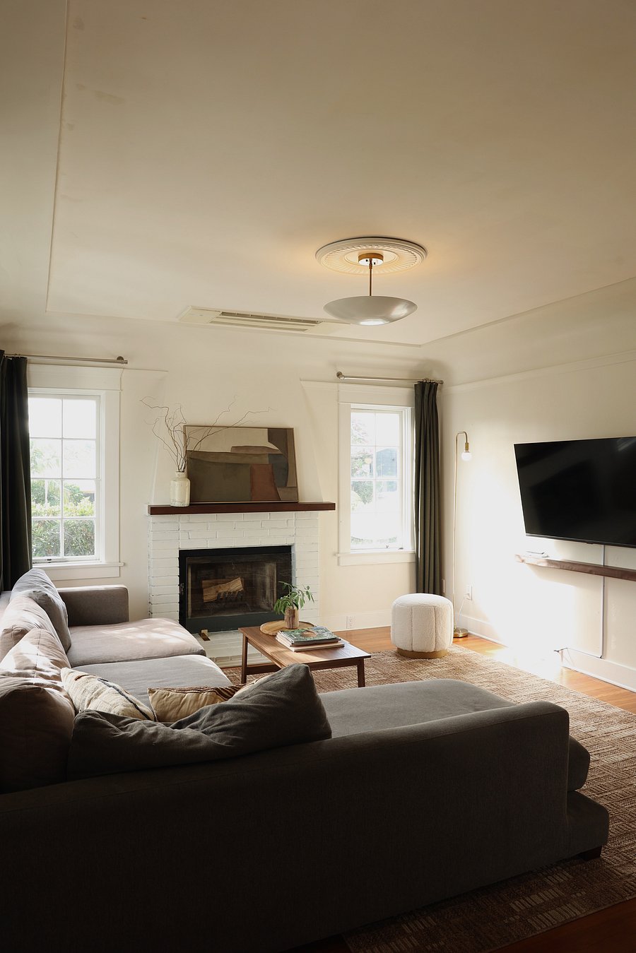Living room with smart TV and a very and comfortable large sectional.