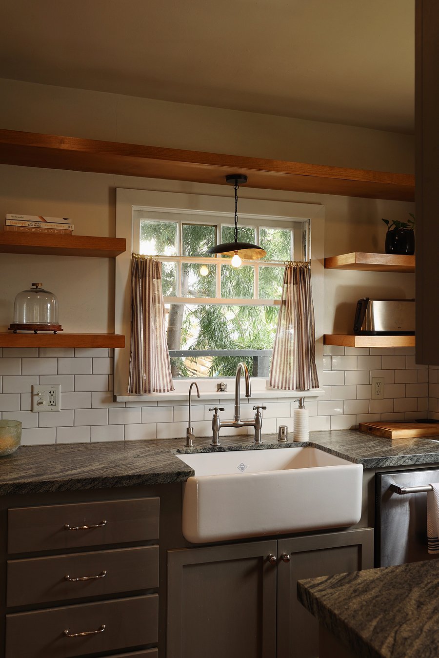 Kitchen with open shelving and lots of natural light.