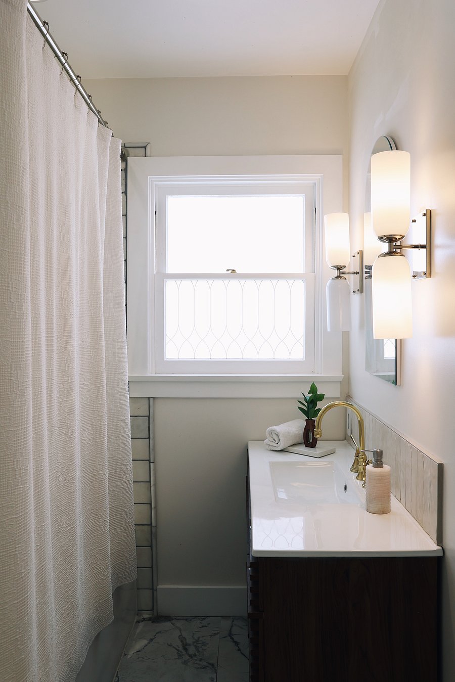Our bathroom with a rainwater shower and lots of storage.