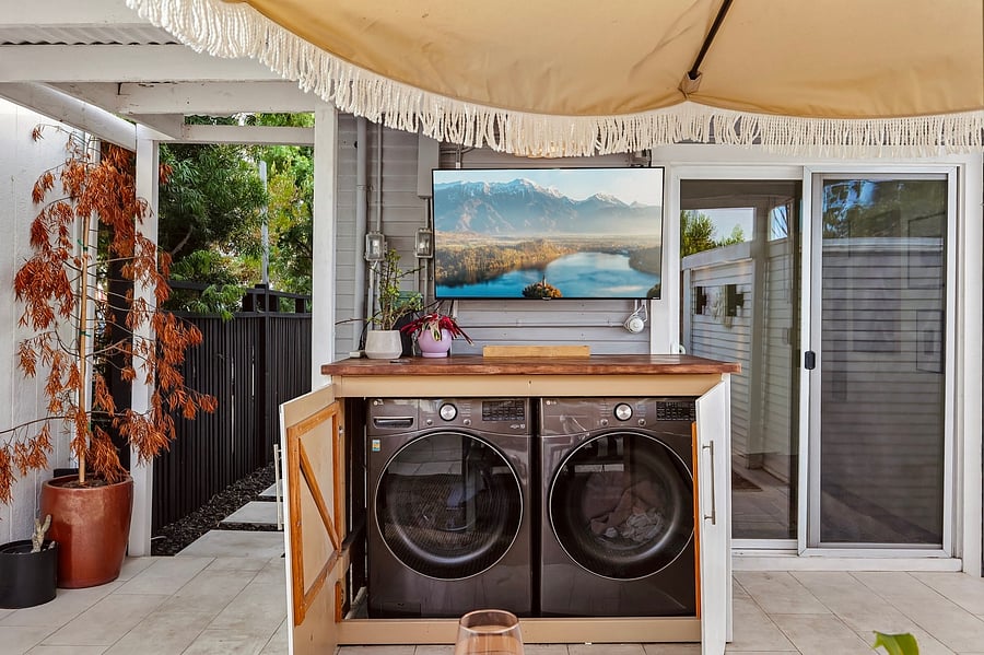 New washer and dryer in a custom cabinet. Smart Outdoor TV