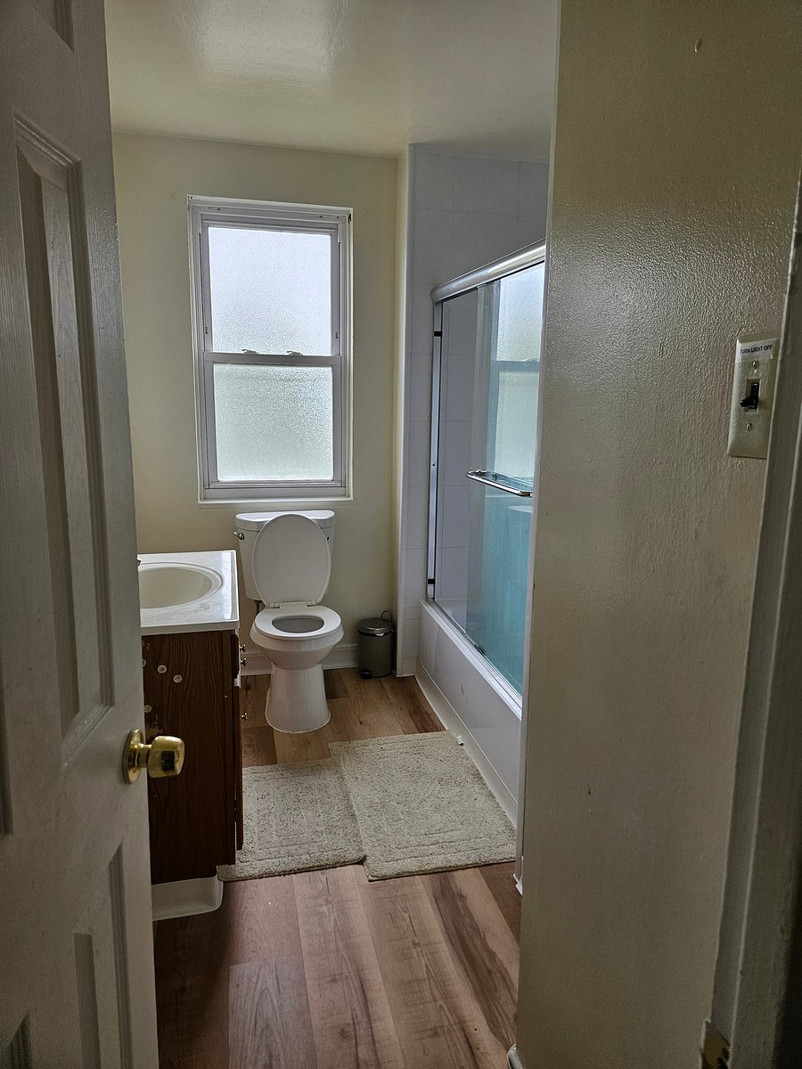 Bathroom shared with two other tenants.