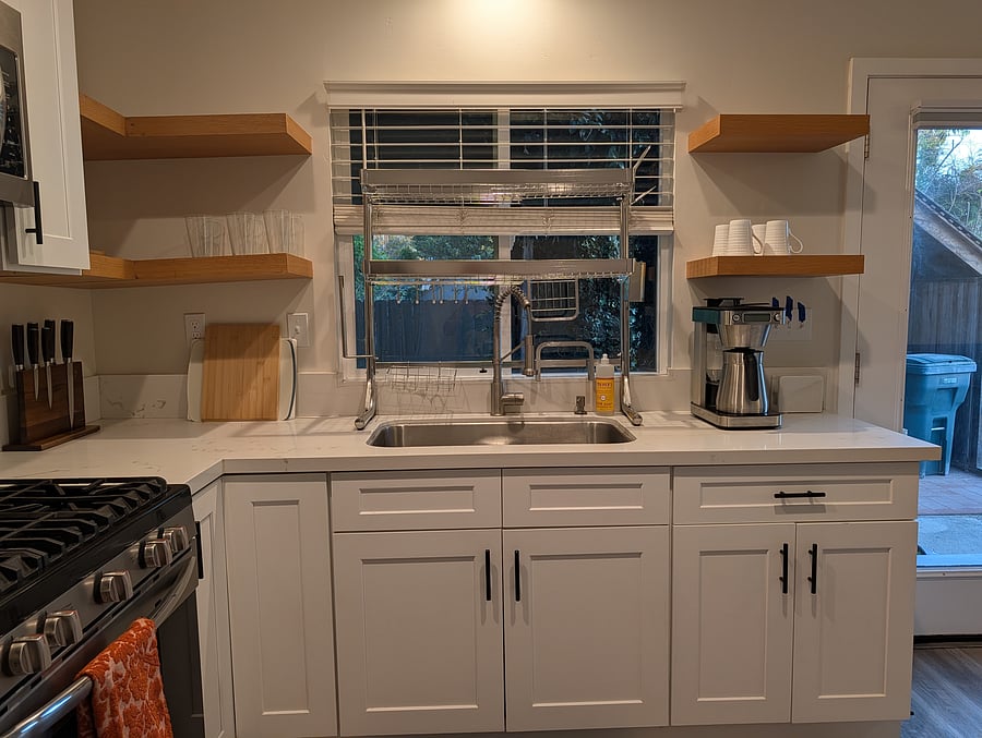 Kitchen sink with space saving dish rack.